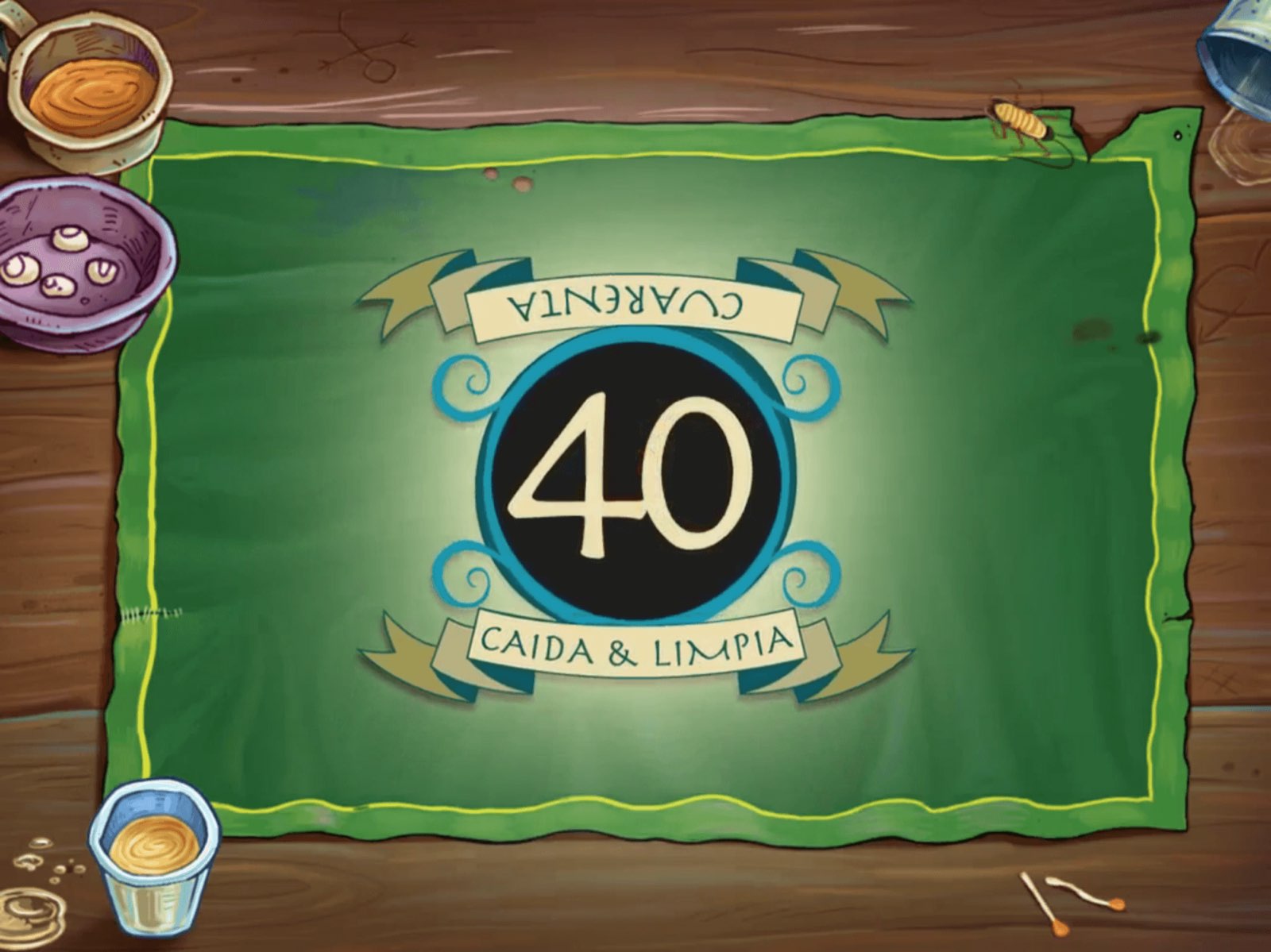 Pantalla de inicio de 40 Caída y Limpia con el logo del Cuarenta sobre la mesa